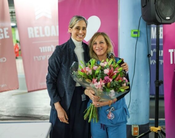 Dr. Michal Mekel, Director General, Rambam Health Care Campus congratulates Gila Hyams, Director of Nursing at the Rambam Healthcare Campus event.