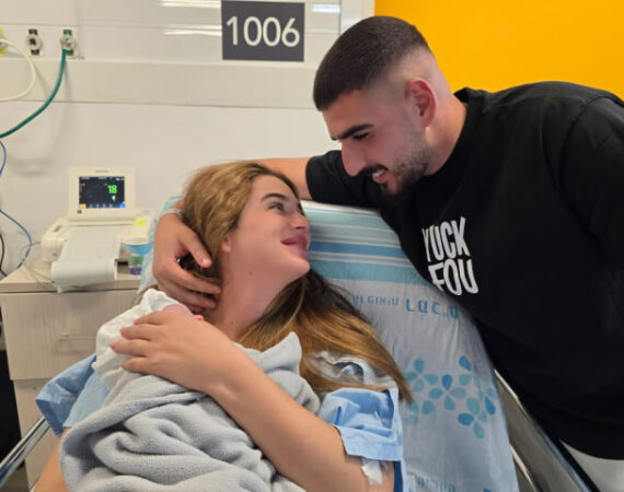 Man and wife in hospital bed